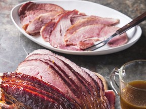 This undated photo provided by America's Test Kitchen shows Glazed Spiral Sliced Ham in Brookline, Mass. This recipe appears in "Cook's Illustrated All-Time Best Holiday Entertaining."