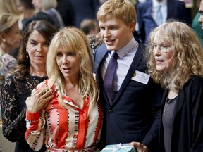 Pulitzer Prize winner for public service Ronan Farrow, second from right, his mother Mia Farrow, far right, Anabella Sciorra, far left, and Rosanna Arquette, second from left, two women accusing Harvey Weinstein of sexual misconduct, arrive for the 2018 Pulitzer Prize winners awards luncheon at Columbia University, Wednesday May 30, 2018, in New York.