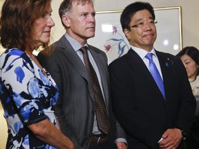 Katsunobu Kato, right, Japan's Health, Labour and Welfare Minister and minister in-charge of nation's abduction issue, holds a meeting with the parents of Otto Warmbier, his father Fred, center, and his mother Cindy Warmer, left, Thursday May 3, 2018, in New York. Otto was a 22-year-old University of Virginia undergrad student who died a week after his release from North Korea custody in June 2017.