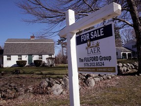 FILE- In this April 23, 2018, file photo, a home is listed for sale in Derry N.H. On Tuesday, May 29, the Standard & Poor's/Case-Shiller 20-city home price index for March is released.
