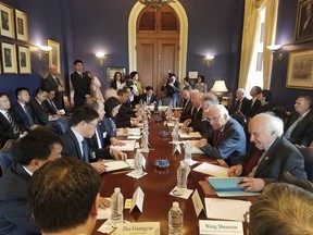 In this May 2018 image provided by Congressman Bill Pascrell's office, Rep. Pascrell, D-N.J., second from right seated at table, attends a meeting regarding trade with other colleagues and a Chinese delegation. After high-level talks last week in Washington, Beijing agreed in a joint statement with the U.S. to "substantially reduce" America's trade deficit with China, but did not commit to cut the gap by any specific amount. (Courtesy Congressman Bill Pascrell's Office via AP)