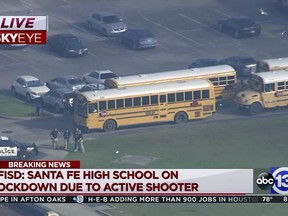 In this image taken from video law enforcement officers respond to a high school near Houston after an active shooter was reported on campus, Friday, May 18, 2018, in Santa Fe, Texas. The Santa Fe school district issued an alert Friday morning saying Santa Fe High School has been placed on lockdown. (KTRK-TV ABC13 via AP)