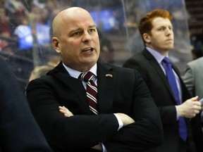 FILE - In this March 25, 2017, file photo, Denver head coach Jim Montgomery works the bench during the first period in the regional semifinals of the NCAA college hockey tournament against Michigan Tech in Cincinnati.  A person with knowledge of the situation tells The Associated Press that the Dallas Stars will hire Montgomery to be their next head coach. Montgomery takes over Ken Hitchcock, who retired last month and will become a consultant for the Stars. The person spoke on condition of anonymity Wednesday, May 2, 2018,  because the hiring had not been announced.