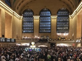 Commuters are stranded in Grand Central Terminal during the evening commute, Tuesday, May 15, 2018, in New York. The Metro-North commuter railroad said Tuesday evening that downed trees across the tracks had caused it to suspend service on its Harlem, Hudson and New Haven lines.