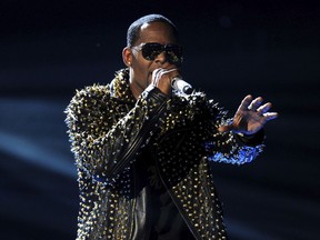 FILE - In this June 30, 2013, file photo, R. Kelly performs onstage at the BET Awards at the Nokia Theatre in Los Angeles. Streaming numbers for R. Kelly has remained intact a week after Spotify announced it had removed the R&B singer's music from its playlists, citing its new policy on hate content and hateful conduct.