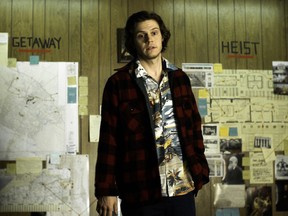 This image released by The Orchard shows Evan Peters in a scene from "American Animals." (The Orchard via AP)
