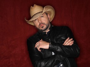 FILE - In this March 19, 2018, file photo, Jason Aldean poses in Nashville, Tenn. Aldean, Carrie Underwood and Florida Georgia Line are the leading nominees for the CMT Music Awards with four each. Little Big Town, who are nominated for three awards, will host the show, which airs on June 6 at 8 p.m. Eastern on CMT.