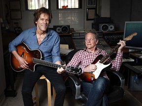 In this May 28, 2018 photo, brothers Kevin Bacon, left, and Michael Bacon pose in New York to promote their self-titled album out Friday. The pair will also launch a three-month concert tour.