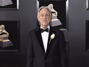 FILE - In this Jan. 28, 2018 file photo, Neil Portnow arrives at the 60th annual Grammy Awards in New York. Portnow will step down as president and CEO of The Recording Academy and the Grammy Awards next year. The organization announced Thursday, May 31, that Portnow chose not to seek an extension on his current contract, which ends next year. He has led the academy since 2002.