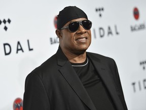 FILE - In this Oct. 17, 2017 file photo, Stevie Wonder attends the TIDAL X: Brooklyn 3rd Annual Benefit Concert in New York.  Wonder says he plans to play a series of shows in the coming months to celebrate life, love and music and push back against troubled times. He gave no specifics other than saying shows in Las Vegas will be in the mix, and that he also hopes to have his long-in-the-works album "Through The Eyes of Wonder" done before 2018 ends.