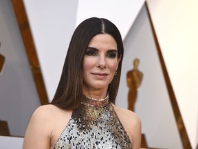 FILE - In this March 4, 2018 file photo, Sandra Bullock arrives at the Oscars in Los Angeles. A man who killed himself during a standoff with Los Angeles police was convicted last year of breaking into Sandra Bullock's home and stalking the Oscar-winning actress, his lawyer said Thursday. Joshua James Corbett missed a court date last month and on Wednesday, May 2, barricaded himself inside his house when police arrived to serve an arrest warrant.