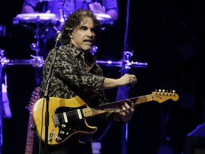 FILE - In this July 17, 2017 file photo, John Oates performs at Gila River Arena in Glendale, Ariz. Oates has also carved a path as a solo artist, and his latest album "Arkansas," is a tribute to Mississippi John Hurt that includes a dash of Dixieland, bluegrass and ragtime tunes, as well as original songs.
