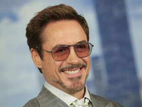 FILE - In this June 25, 2017 file photo, actor Robert Downey, Jr. attends the "Spider-Man: Homecoming" cast photo call in New York.  Downey Jr. will be reprising his role as Sir Arthur Conan Doyle's famed detective Sherlock Holmes alongside Jude Law as his counterpart Watson in  "Sherlock Holmes: A Game of Shadows" coming in 2020.