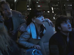 This image released by Lucasfilm shows Joonas Suotamo, from left, Woody Harrelson, Emilia Clarke and Alden Ehrenreich in a scene from "Solo: A Star Wars Story." (Lucasfilm via AP)