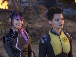 This image released by Twentieth Century Fox shows Shioli Kutsuna, left, and Brianna Hildebrand in a scene from "Deadpool 2."