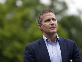 In this May 17, 2018, photo, Missouri Gov. Eric Greitens stands off to the side before stepping up to the podium to deliver remarks to a small group of supporters near the capitol announcing the release of funds for the state's biodiesel program in Jefferson City, Mo. A St. Louis judge on Monday appointed the prosecutor in Jackson County as the special prosecutor who will decide whether to refile an invasion-of-privacy case against Greitens.