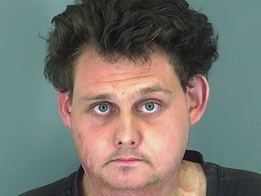This undated photo provided by the Spartanburg County Detention Center in South Carolina shows Brandon Lecroy. Authorities say Lecroy thought he was offering $500 to a hit man to kill his black neighbor, hang his body from a tree and burn a cross on his lawn, but he was mistaken. Court documents show the supposed hit man contacted through a white supremacist group was really an undercover officer, and 25-year-old Lecroy was charged with murder for hire. (Spartanburg County Detention Center via AP)