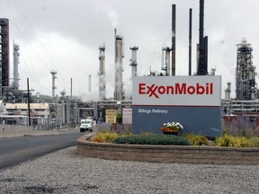 FILE - This Sept. 21, 2016, file photo shows Exxon Mobil's Billings Refinery in Billings, Mont. New trails, fishing sites and other recreational features will be built along Montana's Yellowstone River as compensation for damage from an Exxon Mobil Corp. pipeline spill, under a plan approved Wednesday, May 30, by the governor.