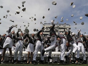 West Point graduates toss their caps into the air at the end of graduation ceremonies at the United States Military Academy, Saturday, May 26, 2018, in West Point, N.Y.