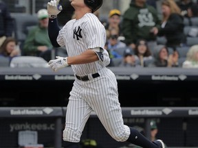 New York Yankees designated hitter Aaron Judge reacts as he rounds the bases after hitting a two-run home run against the Oakland Athletics during the fifth inning of a baseball game, Saturday, May 12, 2018, in New York.