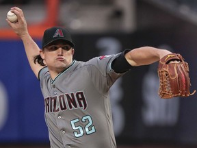 Arizona Diamondbacks pitcher Zack Godley (52) delivers against the New York Mets during the first inning of a baseball game, Friday, May 18, 2018, in New York.