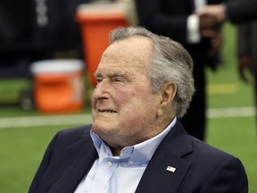 FILE- In this Nov. 5, 2017, file photo, former president George H.W. Bush arrives for an NFL football game between the Houston Texans and the Indianapolis Colts in Houston. A spokesman for the former president says the 93-year-old has been hospitalized for low blood pressure and fatigue. Spokesman Jim McGrath tweeted just after 2 p.m. Sunday, May 27, 2018, that Bush will likely remain in the hospital for a few days.