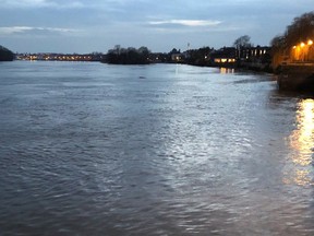This March 2018 photo shows a late-day view of the Thames River as seen from Hammersmith, a district of west London. Visitors to London looking to save money might consider lodging in areas like Hammersmith, away from central London. Just make sure you're not too far from public transportation.