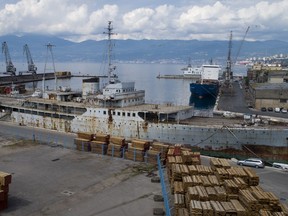 In this Thursday, May 10, 2018 aerial photo, the Galeb (Seagull), the yacht once used by the late president of socialist Yugoslavia Josip Broz Tito, is moored in the port of the Adriatic city of Rijeka, Croatia. Decades of rust are covering its hull, the furniture is broken in its once luxurious salons, its powerful engines are permanently idle _ but against all odds, the iconic yacht that once belonged to the late Yugoslav strongman has been given a new lease of life and will be turned into a floating museum.