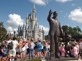 FILE - In this Sept. 2, 2004, file photo, tourists crowd around Cinderella's Castle to watch a performance at Walt Disney World's Magic Kingdom in Lake Buena Vista, Fla. Anyone planning a Disney trip can get free, customized advice from the Disney Parks Moms Panel about rides, restaurants, lodging, transportation and any other aspect of a park visit.