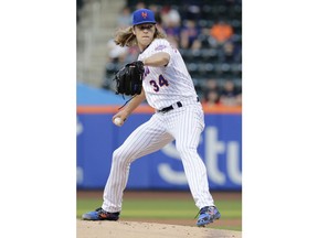 New York Mets' Noah Syndergaard (34) delivers a pitch during the first inning of a baseball game against the Atlanta Braves Tuesday, May 1, 2018, in New York.