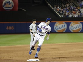 New York Mets' Brandon Nimmo runs the bases after hitting a home run during the fifth inning of a baseball game against the Miami Marlins Wednesday, May 23, 2018, in New York.