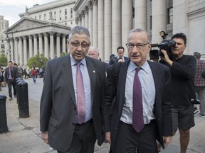 Former New York Assembly Speaker Sheldon Silver, left, leaves federal court, Friday, May 11, 2018, in New York. A jury convicted Silver of public corruption charges Friday, dashing the 74-year-old Democrat's second attempt to avoid years in prison after a decades-long career as one of the most powerful politicians in state government.