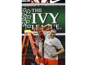 In this March 11, 2018 photo, Princeton's Leslie Robinson reacts as she cuts her piece of the net after an NCAA college basketball championship game in the Ivy League Tournament against Pennsylvania in Philadelphia. Robinson joined an exclusive club when she was drafted by the New York Liberty last month. The former Princeton star is just the third player with Ivy League experience to be taken in the WNBA draft, joining Allison Feaster and Temi Fagbenle. While Robinson's a longshot to make the Liberty, she's happy to have the opportunity.