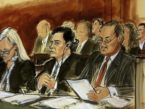 In this courtroom sketch Mehmet Hakan Atilla, second from left, listens to the judge during his sentencing, flanked by his attorneys Cathy Fleming, left, and Victor Rocco as Atilla's wife, upper right, listens to the proceedings Wednesday, May 16, 2018, in New York. U.S. District Judge Richard Berman imposed a sentence of 32 months in prison on the Turkish banker convicted of helping Iran evade U.S. sanctions.