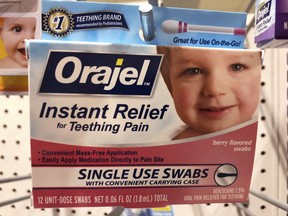 Orajel is displayed for sale in a pharmacy in New York Wednesday, May 23, 2018. The US Food and Drug Administration is warning parents about potentially deadly risks of teething remedies that contain a numbing ingredient used in popular brands like Orajel. The agency on Wednesday said it wants manufacturers to stop selling products intended for babies and toddlers because the products contain a drug ingredient that can cause a rare but dangerous blood condition that interferes with normal breathing.