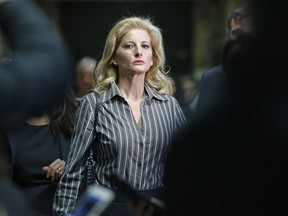 FILE- In this Dec. 5, 2017 file photo, Summer Zervos leaves Manhattan Supreme Court at the conclusion of a hearing in New York. A New York court said Thursday, May 17, 2018, that the former "Apprentice" contestant can proceed with her defamation lawsuit against President Donald Trump, at least for now.