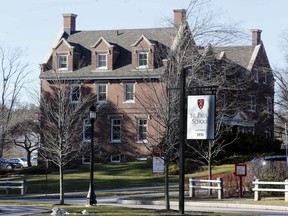 FILE - This Feb. 26, 2016 file photo shows the entrance to St. Paul's School in Concord, N.H. A former boarding school student says in a lawsuit the school violated her civil rights by failing to protect her from sexual assault in a "hypersexualized environment" where older students scored points for having sex with younger ones. The lawsuit, filed Friday, May 11, 2018, in federal court in Concord, claims officials at St. Paul's School failed to report the sexual assault of a freshmen during the 2012-13 school year.