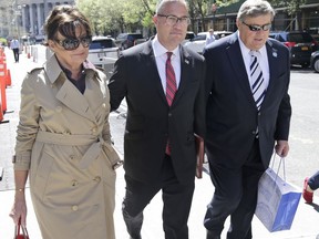 The parents of first lady Melania Trump, Viktor Knavs, right, and Amalija Knavs, left, walk with their attorney Michael Wildes after a meeting related to their immigration proceedings in New York, Wednesday, May 2, 2018.