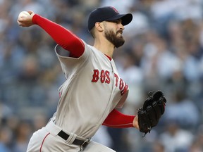 Boston Red Sox starting pitcher Rick Porcello winds up during the first inning of the team's baseball game against the New York Yankees in New York, Wednesday, May 9, 2018.