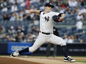 New York Yankees' Sonny Gray delivers a pitch during the first inning of the team's baseball game against the Oakland Athletics on Friday, May 11, 2018, in New York.