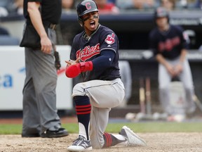 Cleveland Indians' Francisco Lindor reacts after scoring on a Jason Kipnis sacrifice fly during the eighth inning of a baseball game against the New York Yankees in New York, Sunday, May 6, 2018.