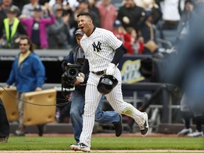 New York Yankees' Gleyber Torres reacts as he runs home on his ninth-inning, walk-off, three-run, home run against the Cleveland Indians in a baseball game in New York, Sunday, May 6, 2018. The Yankees won 7-4.