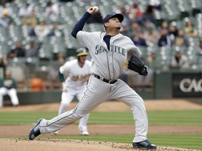 Seattle Mariners starting pitcher Felix Hernandez throws to the Oakland Athletics during the first inning of a baseball game Thursday, May 24, 2018, in Oakland, Calif.