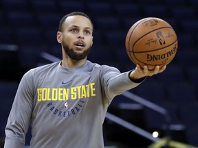 Golden State Warriors' Stephen Curry goes for a layup during an NBA basketball practice, Wednesday, May 30, 2018, in Oakland, Calif. The Warriors face the Cleveland Cavaliers in Game 1 of the NBA Finals on Thursday in Oakland.