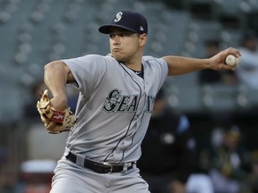 Seattle Mariners pitcher Marco Gonzales throws against the Oakland Athletics during the first inning of a baseball game in Oakland, Calif., Wednesday, May 23, 2018.