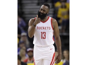 Houston Rockets guard James Harden (13) gestures during the first half of Game 4 of the NBA basketball Western Conference Finals between the Golden State Warriors and the Rockets in Oakland, Calif., Tuesday, May 22, 2018.