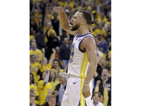 Golden State Warriors guard Stephen Curry (30) celebrates during the second half of Game 3 of the NBA basketball Western Conference Finals against the Houston Rockets in Oakland, Calif., Sunday, May 20, 2018.