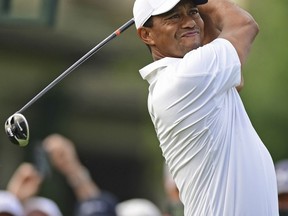 Tiger Woods follows his drive on the tenth hole during the first round of the Memorial golf tournament Thursday, May 31, 2018, in Dublin, Ohio.