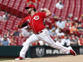 Cincinnati Reds starting pitcher Brandon Finnegan throws in the first inning of a baseball game against the Miami Marlins, Sunday, May 6, 2018, in Cincinnati.