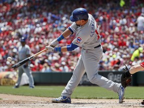 Chicago Cubs' Kyle Schwarber hits a two-run home run off Cincinnati Reds starting pitcher Tyler Mahle in the second inning of a baseball game, Sunday, May 20, 2018, in Cincinnati.